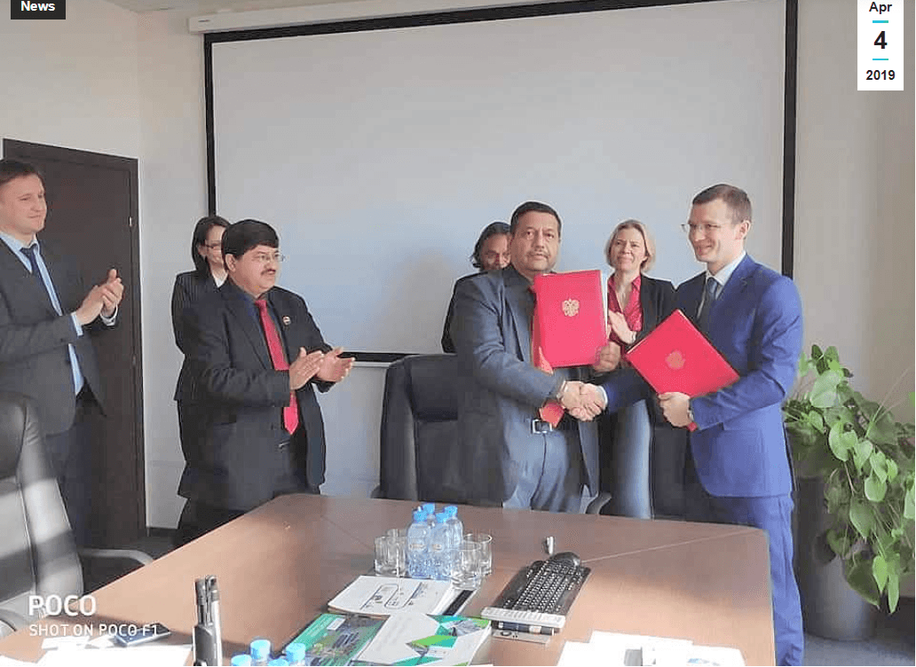 IICCI MoU signing ceremony — leadership handshake with agreement folders